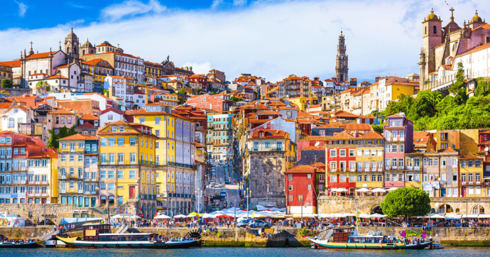 Where's Hot August: Porto, Portugal Old Town skyline from across the Douro River. European destination. Everything travel. Forever Living Yes.