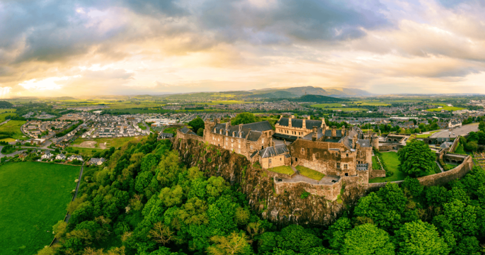 Dramatic drone aerial view of the Stirling Castle during the sunset, Scotland. Things to do. Everything travel.