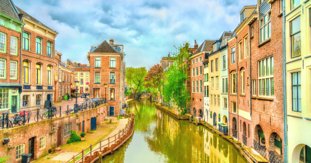 Traditional houses along a canal in Utrecht - the Netherlands. This European destination is a must visit. Everything travel.