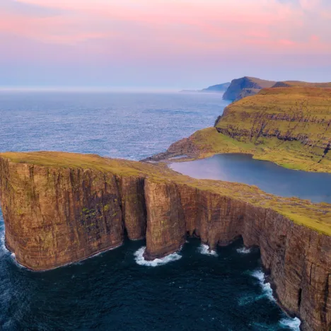 Sorvagsvatn Lake and Waterfall into the Ocean in Western Faroe Island, post processed in HDR