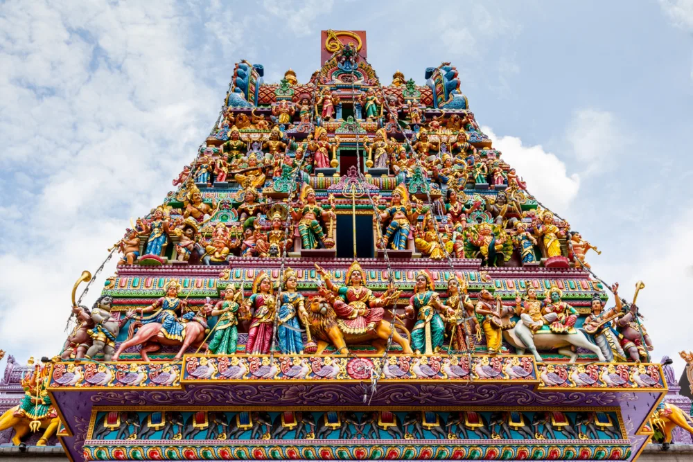 Intricate Hindu art and deity carvings on the facade of Sri Veeramakaliamman Temple in Little India, Singapore, Asia